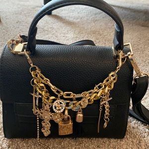 Small black aldo cross body bag with gold hardware and removable accessories